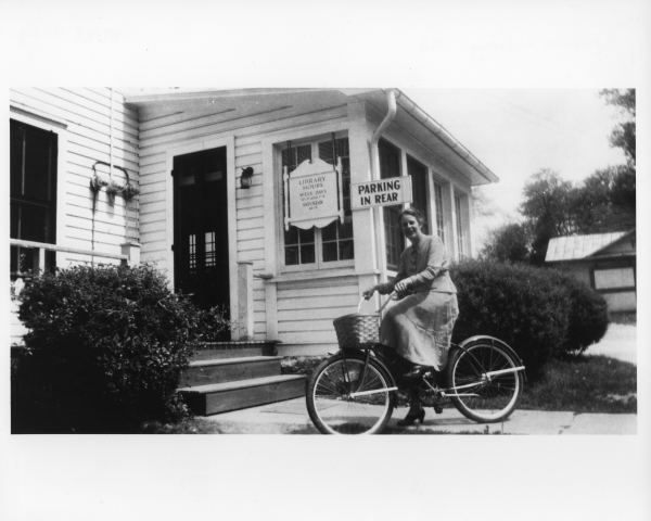 photo of library location at 151 East Broad Street in 1949 with woman on bicycle in front of builidng 